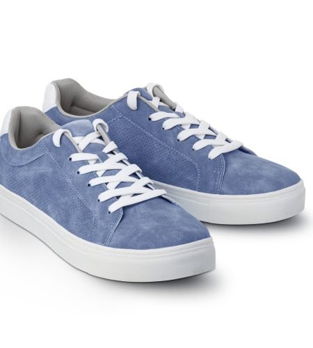Leather blue color men's sneakers with white lace and rubber soles isolated on white background. Men's sports casual shoes. Fashionable sneakers. Male fashion, hipster footwear. With clipping path